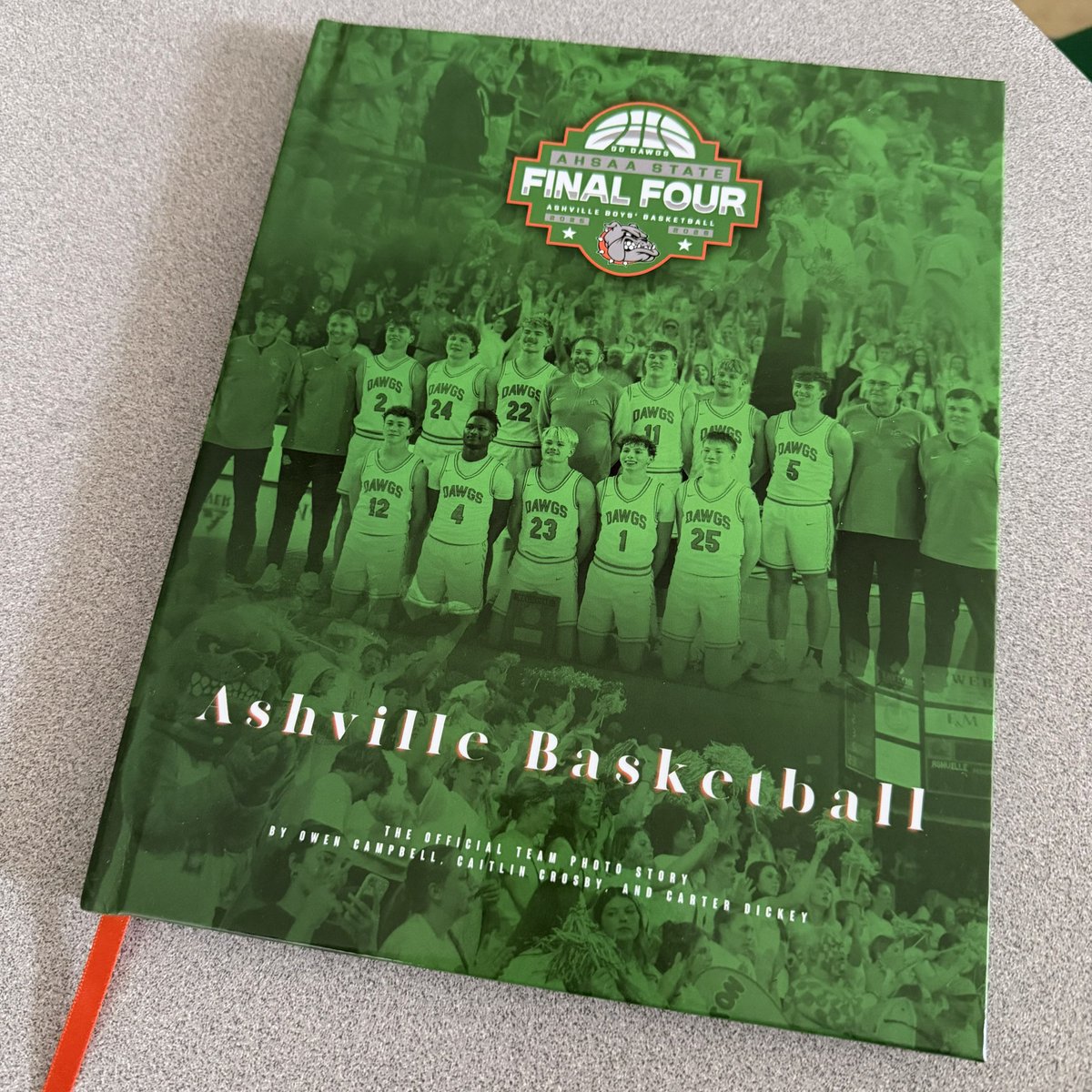 Nick__Wilson__'s tweet photo. Possibly the best trinket/trophy/accessory to come out of this awesome basketball season. 

Shoutout to Owen Campbell, Caitlin Crosby, and Carter Dickey for their hard work and making this book possible. 

Go Dawgs! https://t.co/cuD3g1fP5u