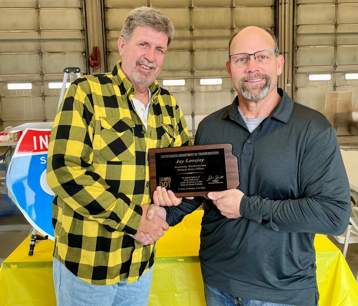SouthDakotaDOT's tweet image. After nearly 22 years of service with the SDDOT, Jay Lovejoy officially retired from the SDDOT on April 8, 2026. Jay, a Construction Technician for the Winner Area, is pictured on the left alongside, Brad Norrid, Winner Area Engineering Manager. 

#SDDOT #Retirement