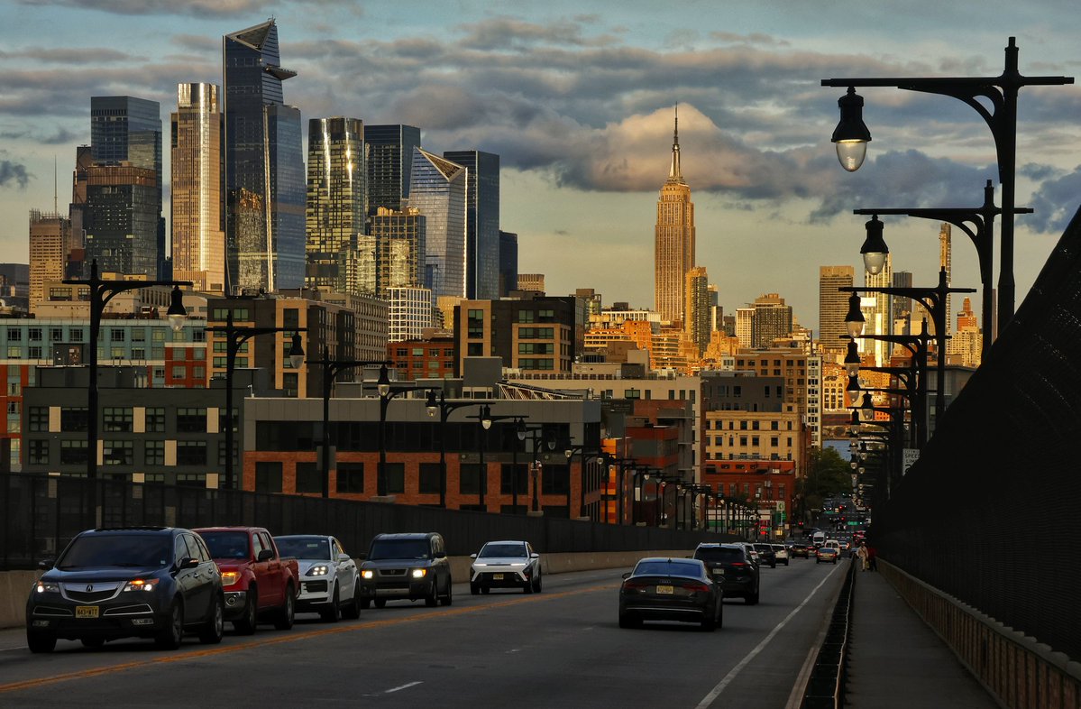 GaryHershorn's tweet image. Sunset on the Empire State Building in New York City, looking down the 14th Street viaduct in Hoboken NJ #nyc #newyork #newyorkcity #sunset @empirestatebldg
