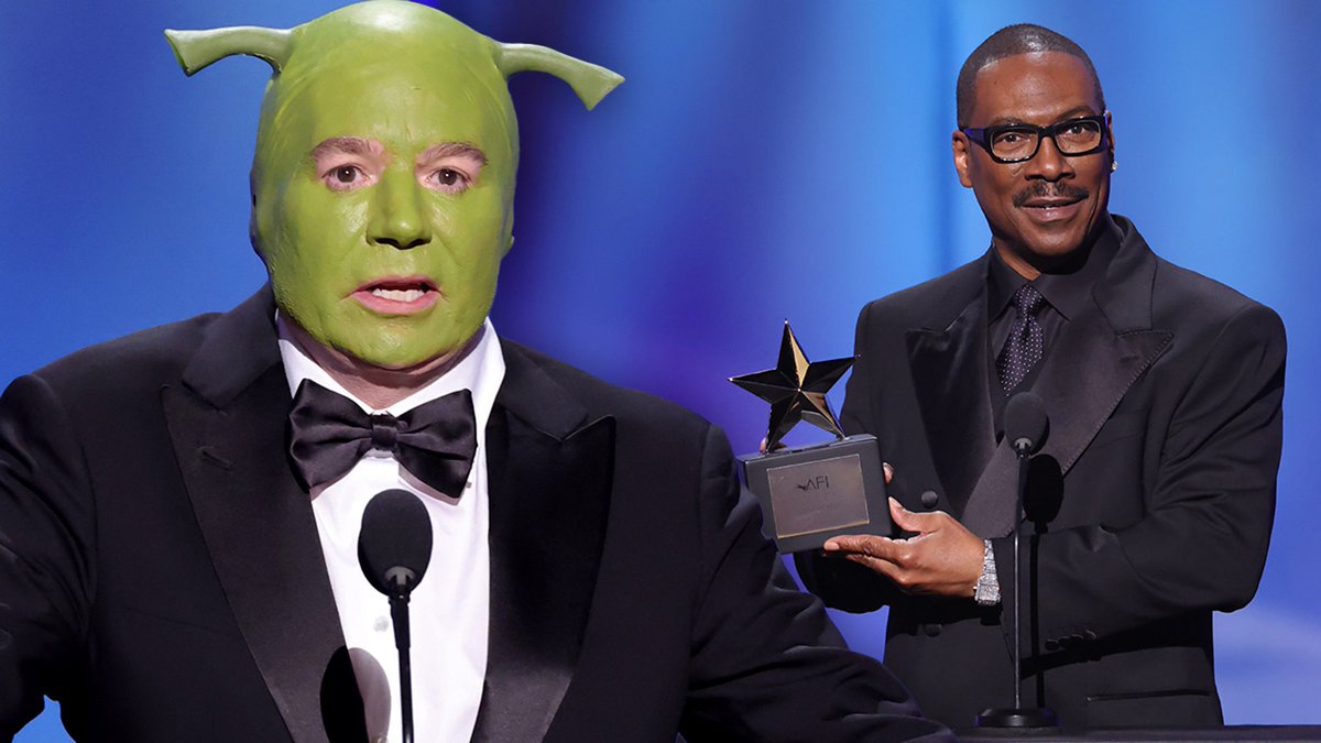TMZ's tweet photo. Mike Myers Crashes Eddie Murphy's AFI Ceremony Dressed As Shrek https://t.co/ZwmUWLOQuh https://t.co/BKMqnlfqTF