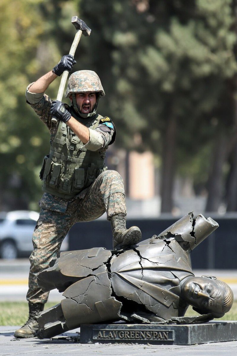 CervicalPrancer's tweet photo. Iranian Soldier smashing a statue of Alan Greenspan with a sledgehammer per IDF sources. https://t.co/uVAnzCuUiA