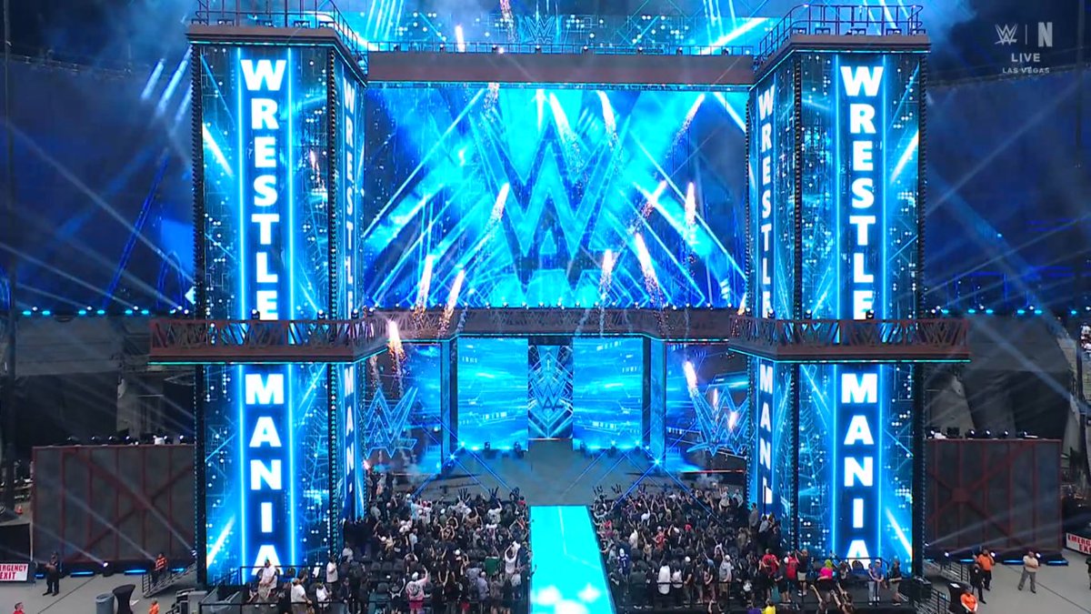 WrestleFeatures's tweet photo. The set has changed to the blue design.

#WrestleMania https://t.co/PYPPz7eruI