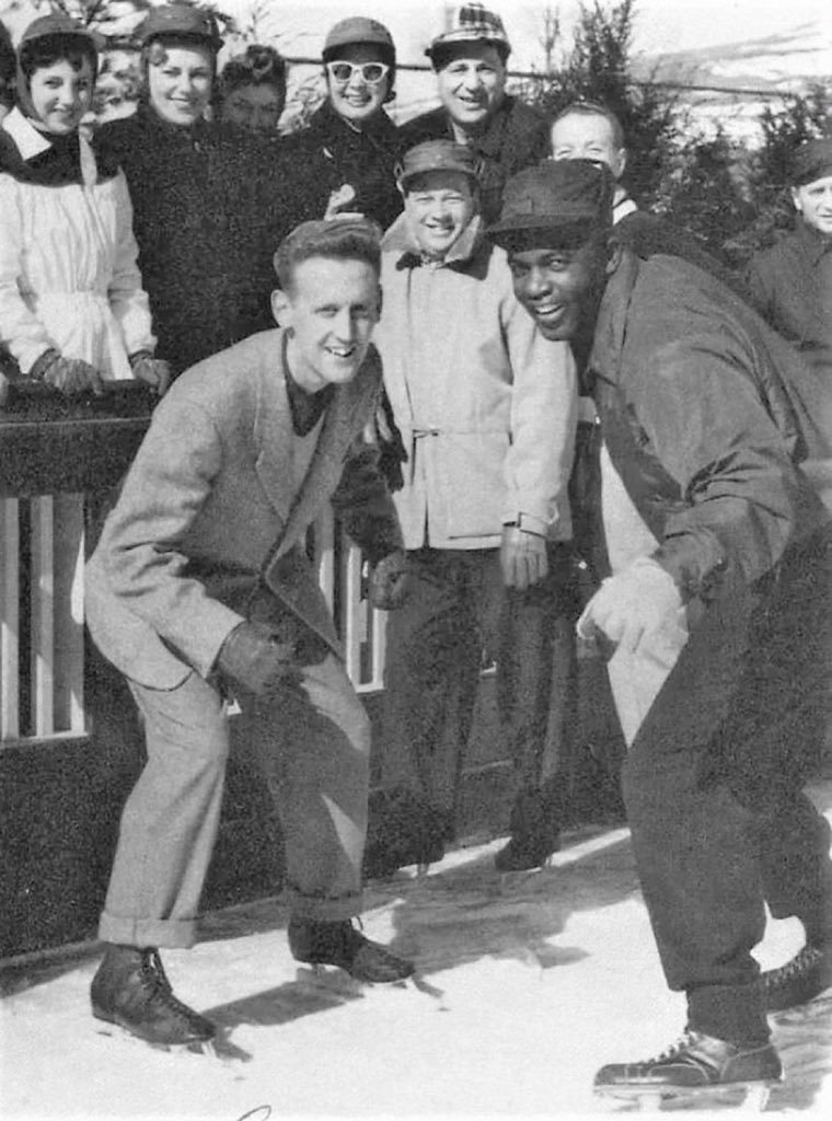 Vin Scully skating with Jackie Robinson.