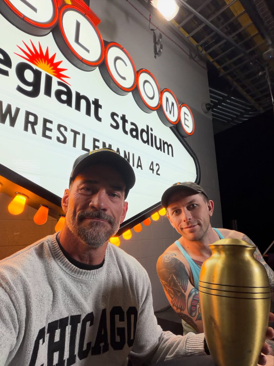 Teffo_01's tweet photo. CM Punk and Danhausen pic with the urn of Bo Lueders 🖤❤️‍🩹 https://t.co/D9pjav8FcO