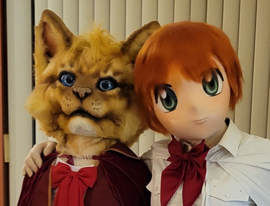 CanadianBanana's tweet photo. Look!  Look!  It's Paws as "Puss in Boots" and Tabitha Whitemage as White Wizard!  You'll see us at Anime North 2026 in Toronto!
#animegao #kigurumimask #finalfantasycosplay #animenorth https://t.co/PtQYVrjWd1
