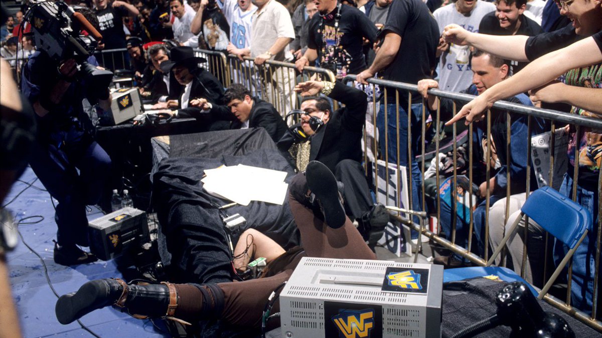 WWFWrestling1's tweet image. 📸 Shot from this day in 1997 as the eternally unlucky Spanish announce table gets demolished by Mankind via the Undertaker. #WWF #WWE #Wrestling #InYourHouse #Mankind #Undertaker