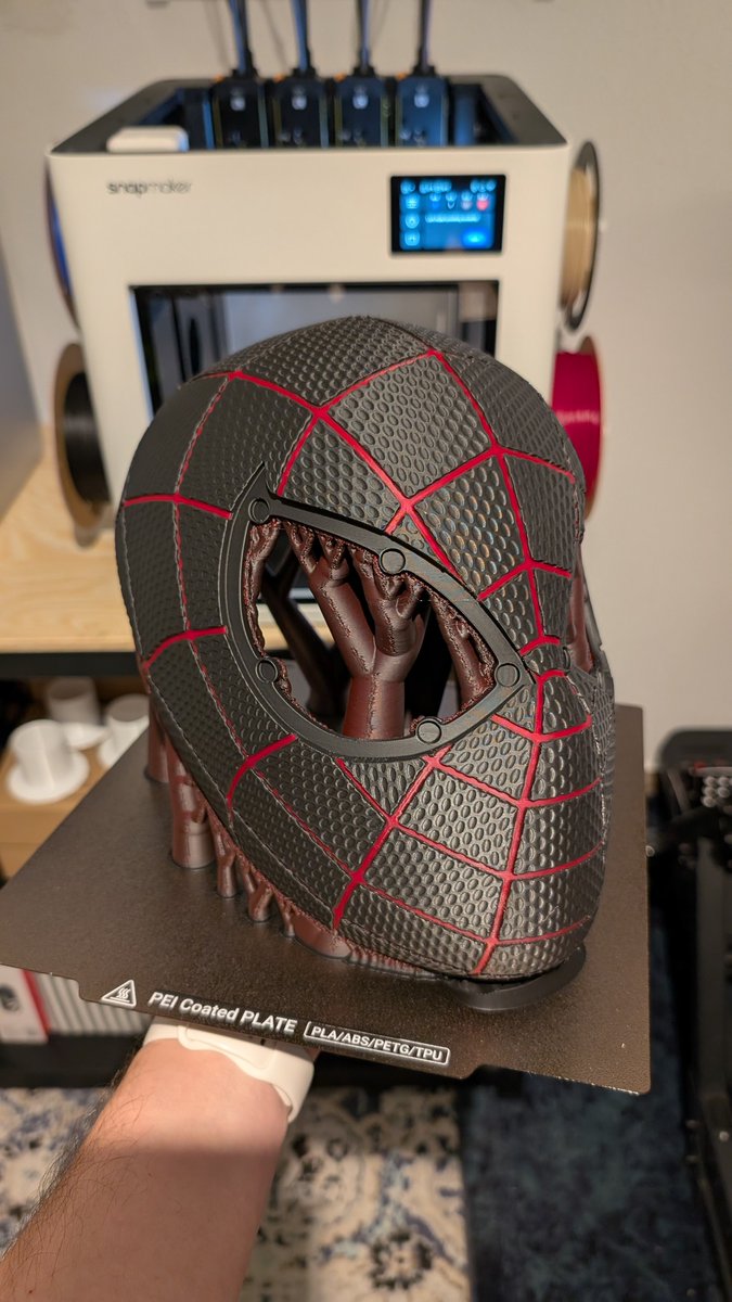 snapmaker's tweet image. Mask on. Hero mode activated. 🕷️🖤
Miles Morales PS5 textured helmet, brought to life with 3D printing. Clean lines. Sharp details. Ready for action. ⚡🕸️

Printer: Snapmaker U1
Printed by: Alex Gittfried
Model by: Budwin3d (MakerWorld)

#SnapmakerU1 #3DPrinting #Cosplay