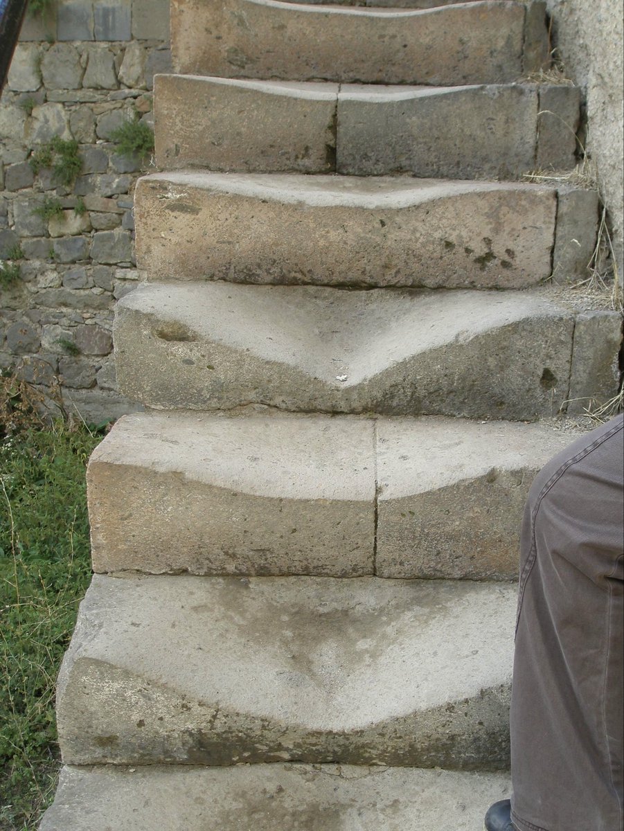 VistraRex's tweet photo. @FoMaHun An example of worn stone steps from hundreds of years of use at Geghard Monastery in Armenia (before they were replaced with new steps). I’m guessing the stairs at the Dendera Hathor Temple eroded from the many years of use as well. https://t.co/OQoKQjoW5D