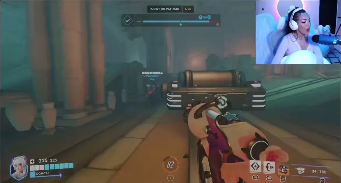 IrelandOWWC's tweet photo. After trying out Overwatch for the first time, Doja Cat allegedly asked our flex support @NutOW_ to queue ranked. 

He left her on read, telling reporters he was too busy "being everywhere all at once" 

#OWWC2026 #GetNuttedOn #LightTheÉire https://t.co/niBFMXkBXw