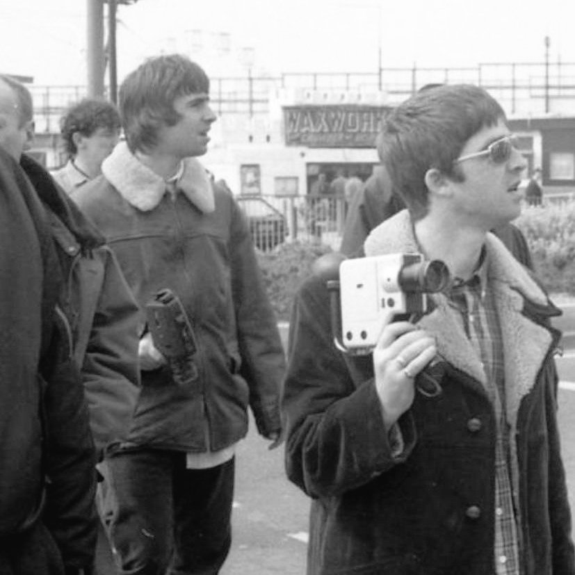 brycclem's tweet image. Liam and Noel with cameras in the Rock 'n' Roll Star music video