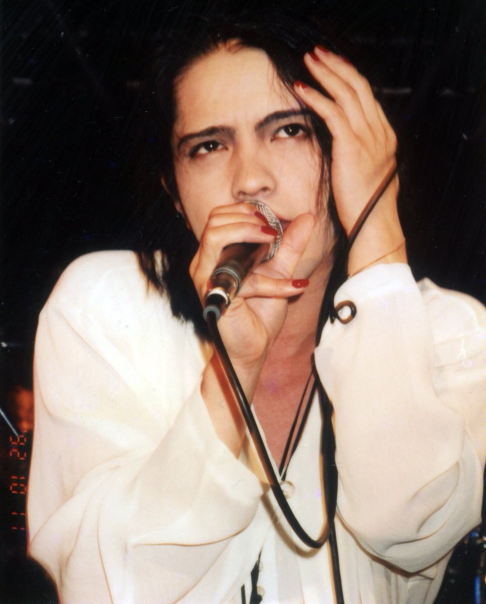 HYDE from L'arc～en～Ciel, performing live on the 11th of October, 1992. Scanned by me from a photograph taken by a fan at the time.