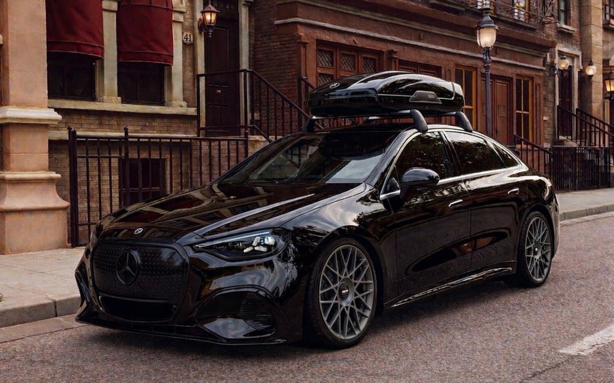 New Mercedes-Benz C-Class EV imagined with Rotiform BLQ-C wheels, lowered suspension, blacked-out grille, and a roof box.