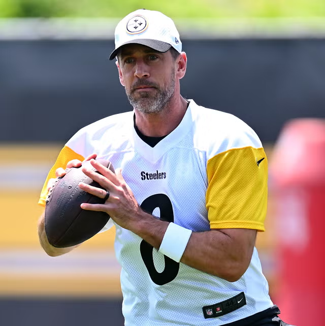 game7__'s tweet photo. Of course AJ Brown would rather play with Drake Maye than Jalen Hurts. 

Is there a single NFL player in the league who would rather play with Jalen Hurts than Aaron Rodgers? Not a player who would rather play in Philadelphia because of the roster. Not a player who would rather have Hurts' age on his side. A player who, given equal circumstances, would choose Jalen Hurts to throw him the football over Aaron Rodgers. That player does not exist.

Aaron Rodgers is 42 years old. He tore his Achilles tendon on the fourth snap of the 2023 season. He came back and played all 17 games in 2024 on a Jets team that went 5-12 around him. He signed with the Pittsburgh Steelers for 2025, and according to multiple reports was the primary reason Pittsburgh reached the playoffs. He is closer to a senior citizen than he is to his athletic prime, and he is still a better quarterback than Jalen Hurts in every measurable way that matters.

Start with the numbers that define a career. Rodgers has four MVP awards. Four. He won them in 2011, 2014, 2020, and 2021, including back-to-back MVPs in his late thirties. Hurts has zero. His best MVP finish was second place in 2022, when he lost the award to Patrick Mahomes. Rodgers has four First-Team All-Pro selections. Hurts has one Second-Team All-Pro. Rodgers has 10 Pro Bowl selections. Hurts has three. Rodgers has a career passer rating of 102.3. Hurts has never sustained anything close to that over the course of a career. Rodgers' career touchdown-to-interception ratio is 4.56 to 1, the best in NFL history. He once threw 402 consecutive passes without an interception, an NFL record. Hurts threw four interceptions and fumbled in a single game against the Los Angeles Chargers in December 2024 and became the first player since 1978 to turn the ball over twice on the same play.

Those are not comparable resumes. Those are not even in the same conversation.

But the argument people will make for Hurts is the ring. Hurts won Super Bowl LIX in February 2025, beating the Kansas City Chiefs 40-22 and earning Super Bowl MVP with 17 completions on 22 attempts, 221 passing yards, two touchdown passes, and 72 rushing yards. That is a real accomplishment. Nobody should take that from him. He also lost Super Bowl LVII two years earlier, 38-35 to those same Chiefs, despite putting up 304 passing yards and three rushing touchdowns, because a fumble in the second quarter was returned for a touchdown by Nick Bolton and shifted the momentum of the game.

Rodgers won Super Bowl XLV after the 2010 season, beating the Pittsburgh Steelers 31-25. He went 24 of 39 for 304 yards, three touchdowns, zero interceptions, and a 111.5 passer rating. He won Super Bowl MVP. One ring each. The difference is what comes after.

What came after for Rodgers was four more MVP awards, a decade of elite play, and a career that put him in the conversation for the most talented quarterback to ever throw a football. What came after for Hurts was the 2025 season.

Hurts' 2025 was a regression by every measure. According to reports, he posted a career-low 7.1 yards per attempt and a 65 percent completion rate, his worst in four years. His rushing production dropped to 421 yards after putting up 630 the year before. ESPN reported that Hurts "continually fights against under-center play" because he does not like turning his back on the defense, and that the Eagles have "catered to Hurts by playing to his strengths and subsequently limiting how diverse the offense can be." His relationship with offensive coordinator Kellen Moore was described as tense. The locker room frustrations that had been whispered about in prior seasons became louder. And in the Wild Card round of the 2025 playoffs, Hurts and the Eagles were eliminated 23-19 by the San Francisco 49ers. He went 20 of 35 for 168 yards in a game that looked nothing like a Super Bowl champion. Eight months after winning it all, Philadelphia was one and done.

That is who Jalen Hurts is. He is a quarterback who can look transcendent when everything around him is working, when Saquon Barkley is averaging five yards a carry, when the offensive line is giving him clean pockets, when the defense is holding leads. And he is a quarterback who falls apart when the infrastructure cracks. His arm does not save him. His processing does not save him. His legs are not enough.

Rodgers is the opposite. Rodgers has spent the last two decades elevating whatever was around him. The 2024 Jets went 5-12 with one of the worst rosters in football, and Rodgers still threw 28 touchdowns with 11 interceptions and a 90.5 passer rating at age 40 coming off a torn Achilles. The 2025 Steelers won the AFC North and made the playoffs with Rodgers, at 41, throwing 24 touchdowns and just 7 interceptions across a 10-7 season. He does not need the infrastructure. He is the infrastructure.

The arm talent gap is not close. Rodgers has one of the strongest, most accurate arms in the history of the position. His ability to throw off-platform, change arm angles, and place the ball in windows that should not exist is something that cannot be taught and cannot be replicated. Hurts has improved his completion percentage from 52.9 percent as a rookie to the mid-60s, and his deep ball has gotten better, but nobody who watches both quarterbacks throw a football would confuse the two. Rodgers makes throws that Hurts cannot make. That is not an insult. It is a description of physical reality.

The football IQ gap might be even wider. Jason Kelce, who has played with Hurts, has described Rodgers as being "on another level of intellectual ability" for the game. Rodgers scored a 35 on the Wonderlic, placing him in the 96th percentile. He reads defenses pre-snap and adjusts at the line of scrimmage in ways that Hurts, by ESPN's own reporting, resists doing. The report that Hurts "continually fights against under-center play" is not a minor detail. It means he is limiting his own offense because he is uncomfortable with a fundamental aspect of quarterback play. Rodgers has never needed to be catered to. He has always been the one dictating the offense, not the other way around.

The contract makes it worse. Hurts signed a five-year, $255 million extension in April 2023, with $179.3 million fully guaranteed. That made him the highest-paid player in NFL history at the time. The first no-trade clause in Eagles franchise history. For that money, you are not paying for a quarterback who needs a perfect ecosystem to succeed. You are paying for a quarterback who creates the ecosystem. Hurts has not been that player consistently enough to justify the investment, and the 2025 season was the clearest evidence yet.

Rodgers at 42 makes $13.65 million on a one-year deal with the Steelers. He costs a fraction of what Hurts costs and provides more from the quarterback position in the areas that actually matter: accuracy, decision-making, pre-snap reads, pocket presence, and the ability to elevate the players around him regardless of what the defense shows.

The Super Bowl argument is the only card Hurts has that Rodgers cannot match right now, and even that argument is flawed. Rodgers won his Super Bowl as the clear best player on his team. He was the MVP of the game and the engine that drove the entire postseason. Hurts won his Super Bowl on a team that also had Saquon Barkley, one of the best offensive lines in football, and a defense that held the Chiefs to 22 points. His Super Bowl MVP performance was 17 of 22 for 221 yards. That is efficient. It is not carrying.

There is not a receiver in the NFL who would rather catch passes from Jalen Hurts than Aaron Rodgers. There is not a running back who would rather have Hurts' arm keeping safeties honest than Rodgers' arm. There is not a coach who, given the choice, would rather build around Hurts' limitations than Rodgers' command of an offense. Hurts is a good quarterback on a great team. Rodgers is a great quarterback who has been great regardless of the team.

The gap between them is not close. It has never been close. And the fact that one of them has a $255 million contract and the other is on a $13.65 million prove-it deal does not change the fact that the cheaper option is the better quarterback. It always has been.