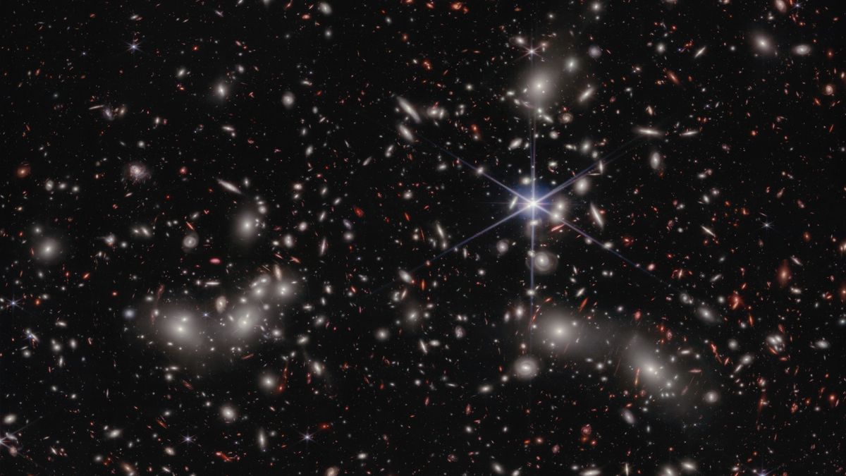 ProfCarlSagan's tweet photo. Look at that distant galaxy, revealed by James Webb Space Telescope. In its ancient light we see our own origins. We are star-stuff, contemplating stars. What a privilege to be alive in this moment of discovery. https://t.co/fsAgTjMbu3