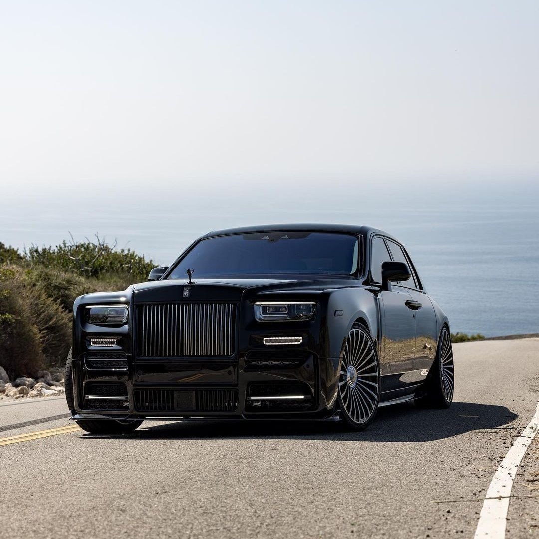Th30ddb411's tweet photo. Midnight black on a coastal road—she doesn't just drive, she looms. Absolute authority in every mile. 🖤🏁 https://t.co/NEbyF1taWU