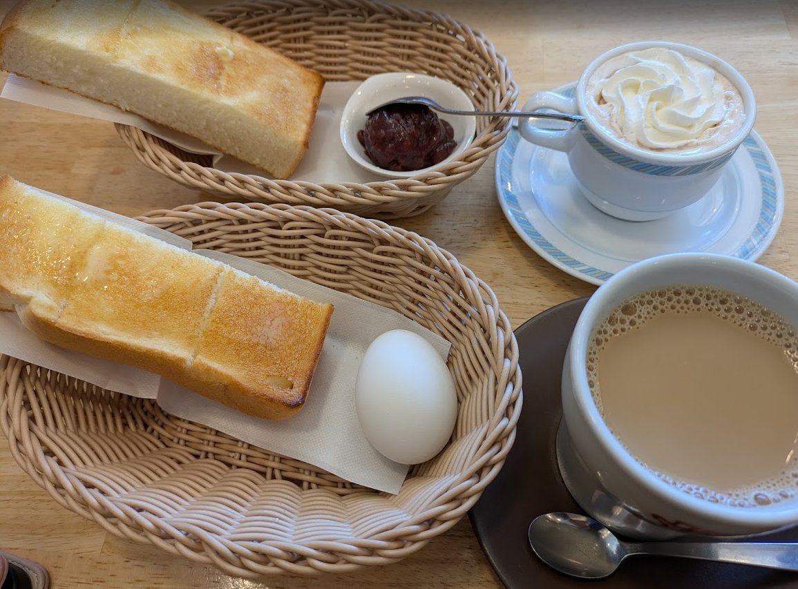W_life_in_Jp_TK's tweet image. In Komeda Coffee, if you order a drink there before 11 AM, you'll get a "morning" which includes bread and spread, or a boiled egg. The bread is Japanese Shokupan, very thick (but only half a slice!), fluffy, and they'll spread butter on it for you. #Japan #cafe #breakfast