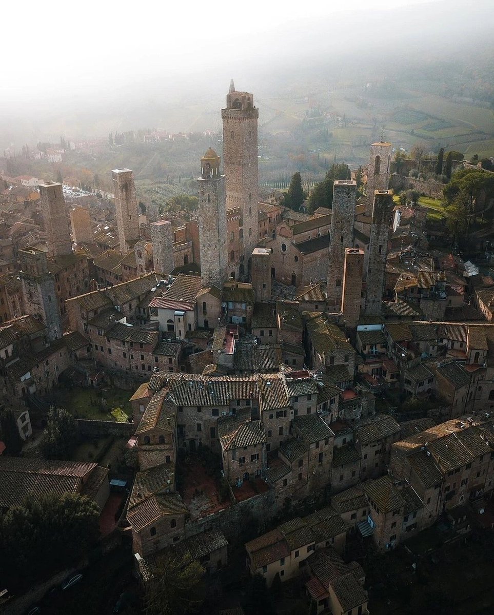 A city of medieval towers on a high hill San Gimignano, Italy.