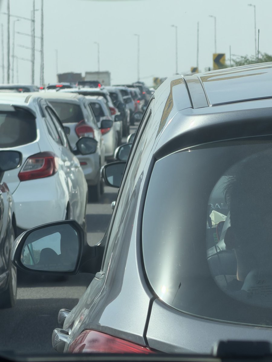srs3150's tweet photo. @dtptraffic incoming traffic enters from the exit of UER-II near yashobhoomi on the bhadurgarh Delhi side. It’s becoming a daily menace. Bikers r entering the expressway and tunnel. Currently there is a huge jam. bikers, truck loads and wrong side entering of vehicles needs check https://t.co/zxhV5tQ5XH