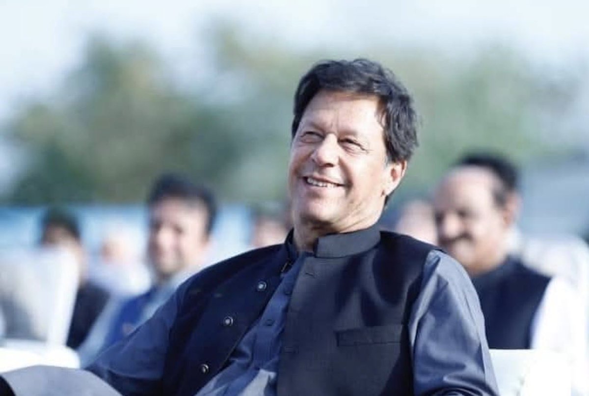Imran Khan, the former Prime Minister of Pakistan
This appears to be a relatively recent or mid-2020s photo of him in a relaxed, smiling pose, wearing a dark shalwar kameez-style outfit with a waistcoat.