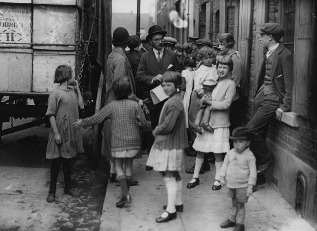 The_East_End's tweet image. C1925 Mr F Leonard, who was an inspector for the Ministry of Health, makes a visit to Limehouse Cottage Gardens in Stepney, where the council is planning to demolish houses and shops to build blocks of flats. Who thought flats were a new thing?… #eastend #History #housing
