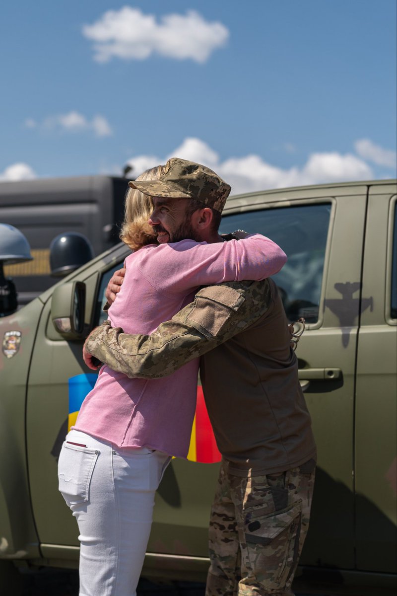 Flore14's tweet photo. 🫂 War is full of brutality, and then suddenly it gives you a moment like this.

A volunteer and a soldier, a #NAFO truck just handed over, and nothing left to say except this hug.

This is what standing with 🇺🇦 actually looks like.

🙏 Donate or repost – link below 🫶🏻 https://t.co/TjD6XaOAbK