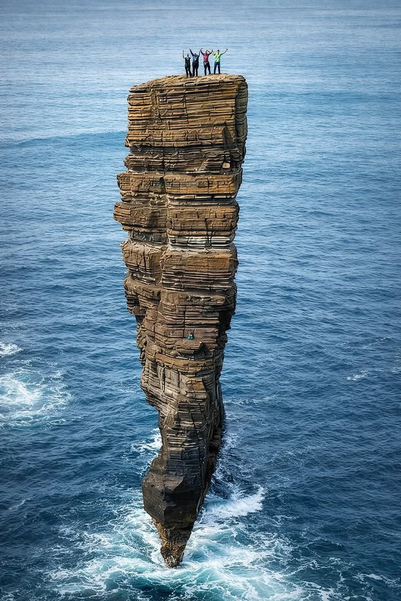 AmazingNature00's tweet photo. The Old Man of Hoy is a 449-foot sea stack on the island of Hoy in Orkney, Scotland. It was shaped over thousands of years by waves and wind that carved it from sandstone and volcanic rock.
This tall, narrow column stands close to the cliffs and is one of the tallest sea stacks in Britain. It continues to slowly change as the sea erodes its base. The Old Man of Hoy is a popular spot for climbers and visitors who come to admire its dramatic beauty and the wild scenery around it.