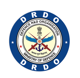 TheRocketMediaX's tweet photo. Meet Dr. Samir V. Kamat !
(Chairman, DRDO and Secretary of R&D at Dept of Defence)

The man leading India’s strategic defence research and next-gen military technologies.

> He did his BTech in Metallurgical Engineering from IIT Kharagpur
> And a PhD in Materials Science & Engineering from University of Virginia
> After that, he joined DRDO as a scientist through the Defence Metallurgical Research Laboratory
> And built deep expertise in high-performance materials, titanium alloys & armour systems
> Also worked on naval materials and high-temperature materials
> Eventually, he became Director, DMRL and Director General (Naval Systems and Materials),
> where he led indigenous development in naval stealth technologies, special alloys, underwater systems, and high-strength defence materials

He took charge as Chairman of DRDO in August 2022

> Overseeing missile systems, naval technologies, electronic warfare & unmanned platforms
> Driving advanced materials innovation and indigenous defence manufacturing
> Supervising strategic defence programmes and major technology trials

At a time when warfare is rapidly evolving:

> He is pushing DRDO for high-risk, high-reward indigenous technologies
> Strengthening India’s defence manufacturing ecosystem
> Enabling MSMEs to play a key role in defence innovation

His core belief: R&D is not an expense, it is an investment.

From materials science labs to leading DRDO,
Dr. Samir V. Kamat’s journey reflects the rise of India’s defence innovation.