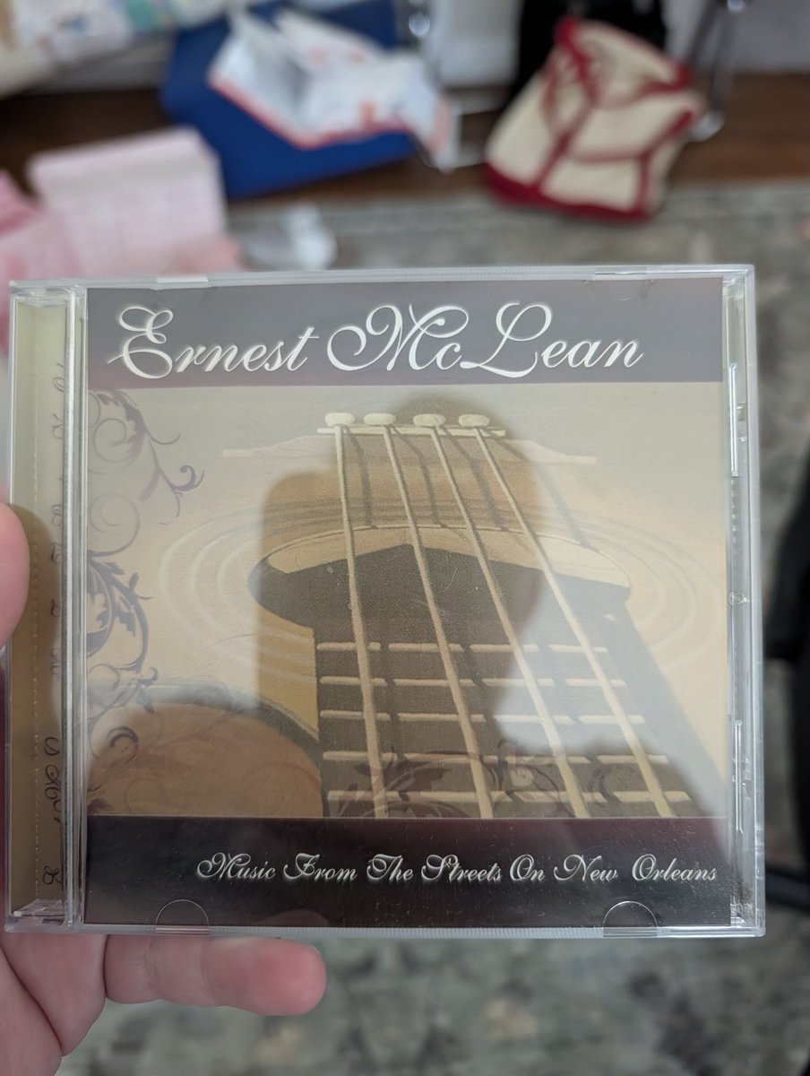 dizchris's tweet photo. Anybody remember Ernest McLean? He used to play blues guitar by the court of Angels in New Orleans square at Disneyland. Bought this CD years ago at what is now the Pandora store. I miss when Disney used to sell the music of park performers. https://t.co/MHBLBoVUhw
