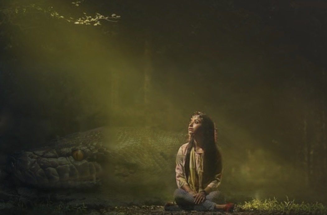 #vss365 
Something pretty beneath shrubbery catches my eye,
more #jade in color than emerald, tourmaline, or peridot.
I stoop, reach, prick a finger, &amp; give a sudden cry.
Something soft, yet firm, wraps around me as I fight. 
El Serpiente makes a meal of me; this is how I die.