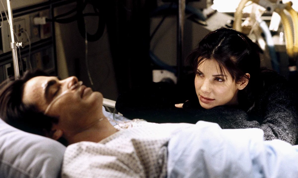 romcomarchive's tweet image. fun fact: the original version of "while you were sleeping" (1995) had the woman in the coma and the man pretending to be engaged to her