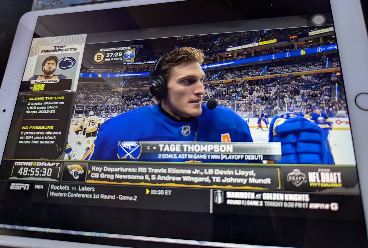 It's the pregame show for a playoff game. Why is 30% of the screen dedicated to covering the draft of another sport that doesn't start for another 48+ hours????