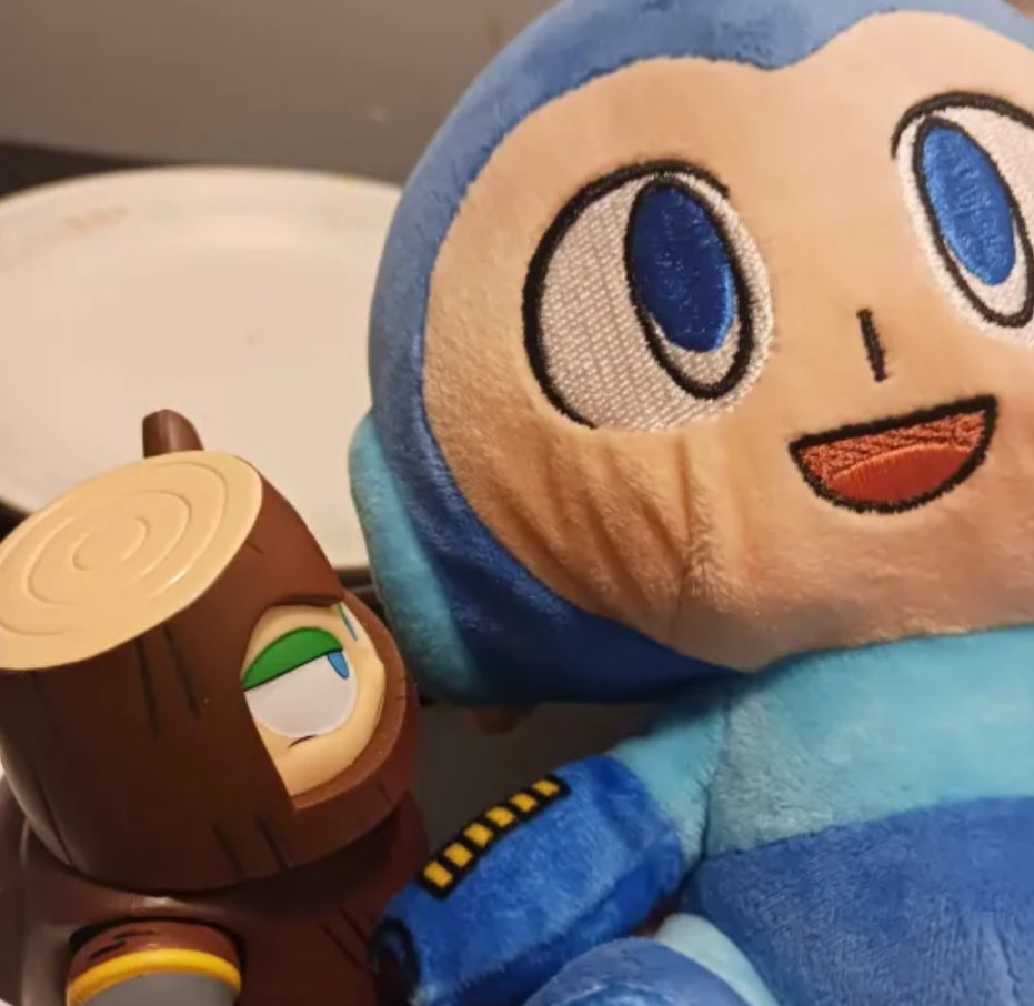 there is thunder somewhere outside of my house so i made my wood man hold mega man Like a Baby