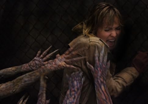 SilentEvil999's tweet photo. Remember this? The first official image from the Silent Hill movie released.

Not a screenshot but a production still. As I recall, these monster hands reminded me of those shrimp fingers coming out of the salad bowls at the end of that dance sequence in Beetlejuice.

Still does! https://t.co/xWDiIQk5pv