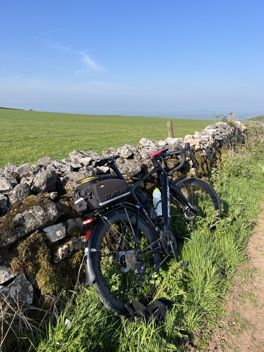Calais2Nice's tweet photo. This was supposed to be a beautiful view from the top of the Mendips. Very windy but been lucky with the direction of the wind so far. Scary steep descent. Buy one get one free at coffee stop. My story. En route to 100+km today. https://t.co/AAZPLcMPC3