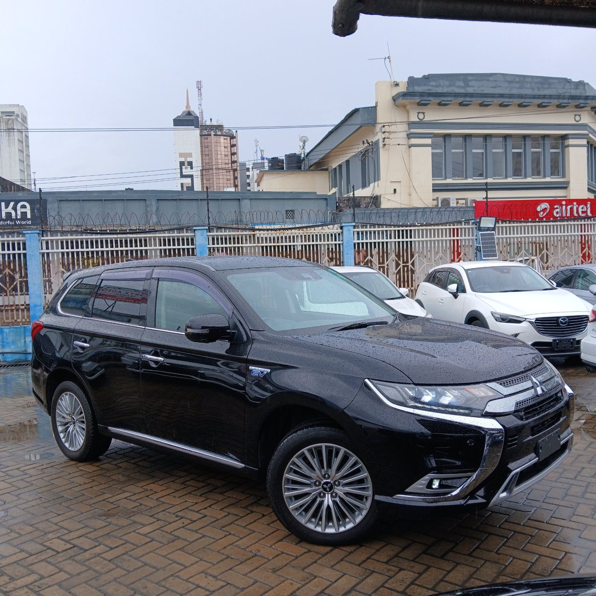 KAutozone's tweet photo. *Mitsubishi Outlander PHEV S Edition*

Year: 2019
Colour: Black
Engine: 2400cc Plug in Hybrid
Transmission: Automatic 
Drivetrain: 4WD
Mileage: 100000 Km
Registration: New

*Features:*
 •   Comes with Hybrid Charging Cable
- Keyless Entry & Start
- Power Windows & Doors
- Power-adjustable Driver's Seat
- Leather Seats 
- Heated Seats
- Automatic Air Conditioning 
- Climate Control
- Factory Alloy Wheels
•   LED Xenon Headlamp
- LED Daytime Running Lights 
- LED Fog Lights 
- Steering Control Buttons 
- Radar Cruise Control
- Traction Control
- Lane Departure Warning
- Brake Assist
- Collision Mitigation System
- Paddle Shifters
- HD LCD Touchscreen Infotainment System 
- Entertainment Screen Display 
- Stereo Sound System 
- USB & HDMI Ports
- Rear & 360° HD Camera
- Power Tailgate
- Parking Sensors
- 4WD Drive Configuration
- Sports Mode Configuration 
- Electric Parking Brake