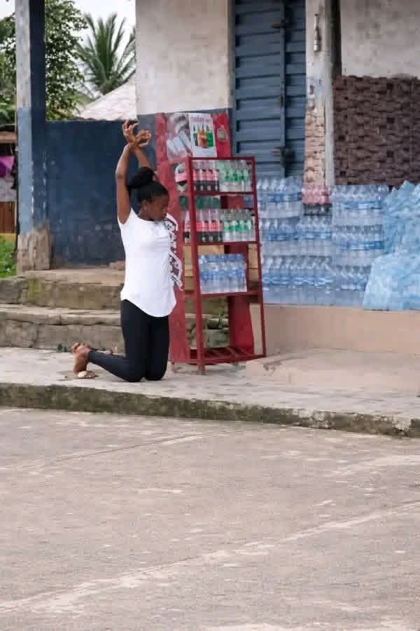 As a man, imagine you went to visit your newly wedded wife at the place where she’s learning hairdressing.

On getting there, you meet her kneeling down like this. You’re confused, so you ask her why she’s on her knees, and she tells you her boss instructed her to do so as a