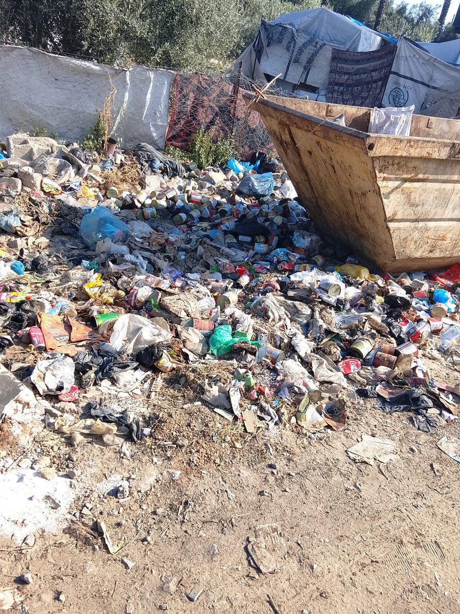 SamiGaza80's tweet photo. Look at this garbage; it's attracting annoying insects that keep us up at night. You're blessed while we're suffering terribly. It's right next to our tents... https://t.co/9gECOV3Pr2