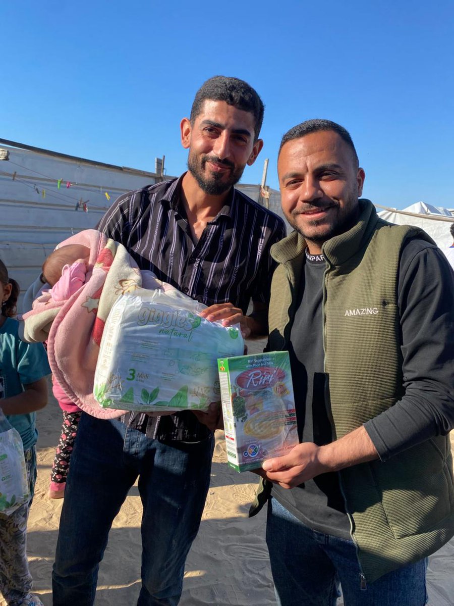 Guys, I’m very happy. People’s prayers and their smiles truly warm the heart from within. We were able to reach 85 children and families and distribute diapers and baby food—Cerelac, some with vegetables and some with fruits. We distributed across three camps and three shelters.