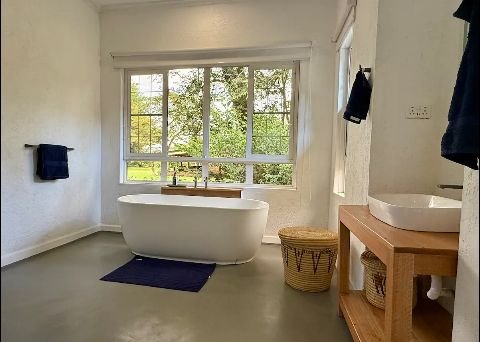 Gogar Farm Cottage, Nakuru. A two bedroom farm cottage with three beds, bathtub, shared garden, outdoor dining area and swimming pool.