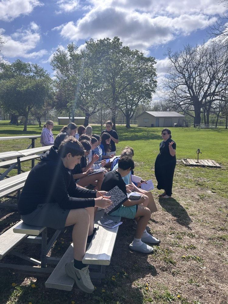 Mrs. O'Herns' Science classes outside to celebrate Earth Day with a question and answer session about the environment.