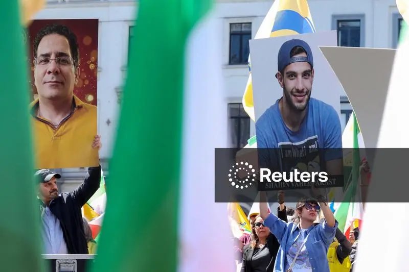BMT_FreeIran's tweet image. 🇪🇺🇧🇪 Reuters: Demonstrators hold images of prisoners executed in Iran, as Iranians and supporters of the National Council of Resistance of Iran (NCRI) take part in a rally calling for the European Union's action against what organisers call political executions in Iran, ahead of