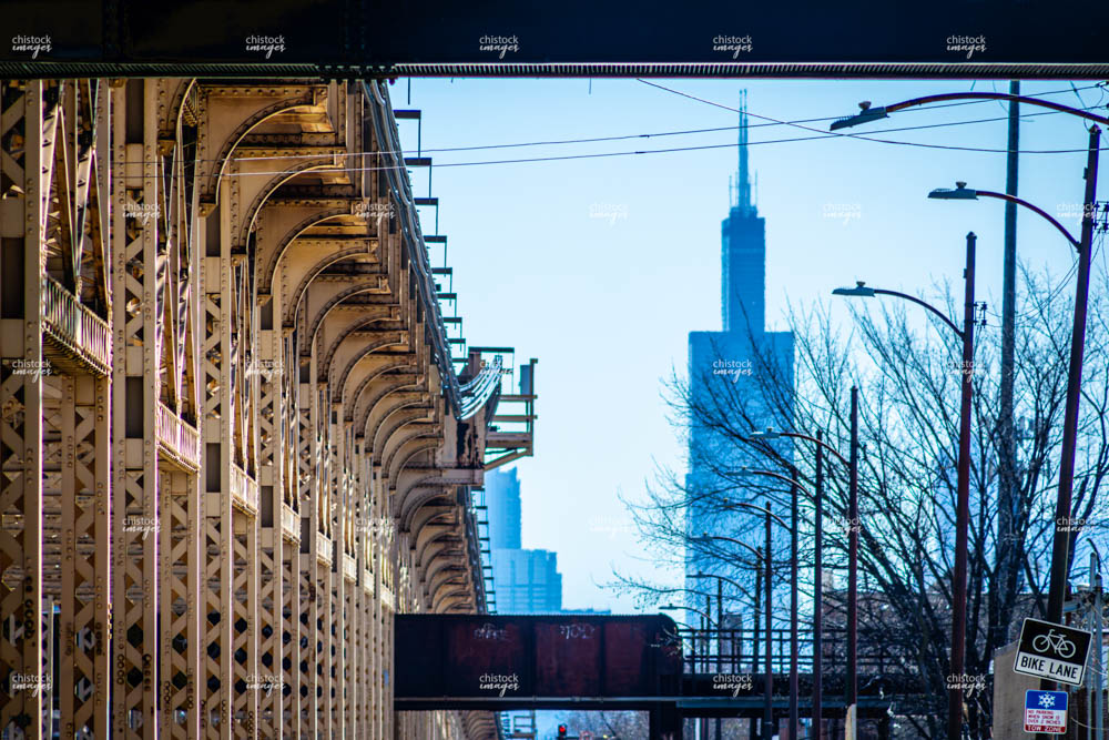ChiStockImages's tweet photo. Austin Chicago Green Line CTA Tracks and Pedestrian Bridge with Sears Tower. https://t.co/zehCiCWlnL