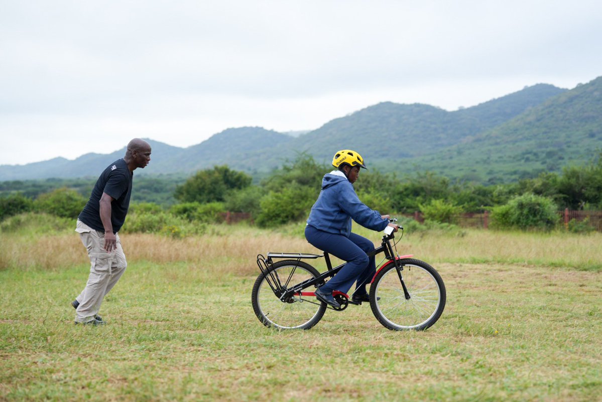 Qhubeka's tweet image. There’s nothing quite like the focus, determination, and pure joy of learning to ride a bicycle for the first time. 🚲

Today is #NewBikeDay with #PumaEnergy, #Trafigura and #TrafiguraFoundation.

100 bicycles to the learners of Mohumi Secondary School.

#FuelTheJourney