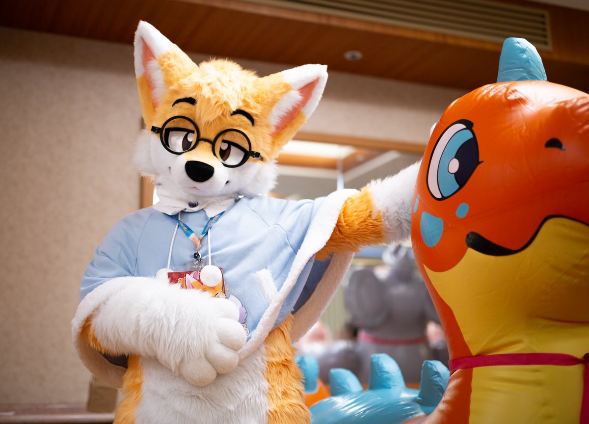 Thoughts... 🦊 💭 If a mischievous fox sits on a dragon toy, 🐉 🎈 does it become a "bad dragon"? 😇 

📸: <a href="/ShujjaWuff/">ShujjaFolf</a> 

#FursuitEveryday #Fursuit