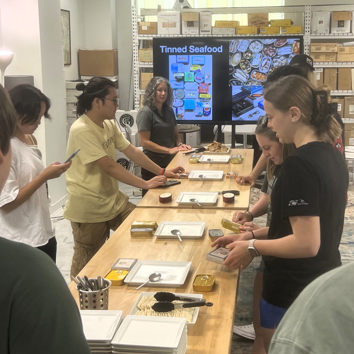 sustainbiomtrls's tweet image. Wine Lab owner, Katie Pritchard, welcomed the Packaging and Culture class for a hands-on, curated, tinned seafood tasting. Students explored the varying packages - not just for shelf life, but as culinary identities! Learning never tasted so good!

#VT #SBIO #PackagingAndCulture