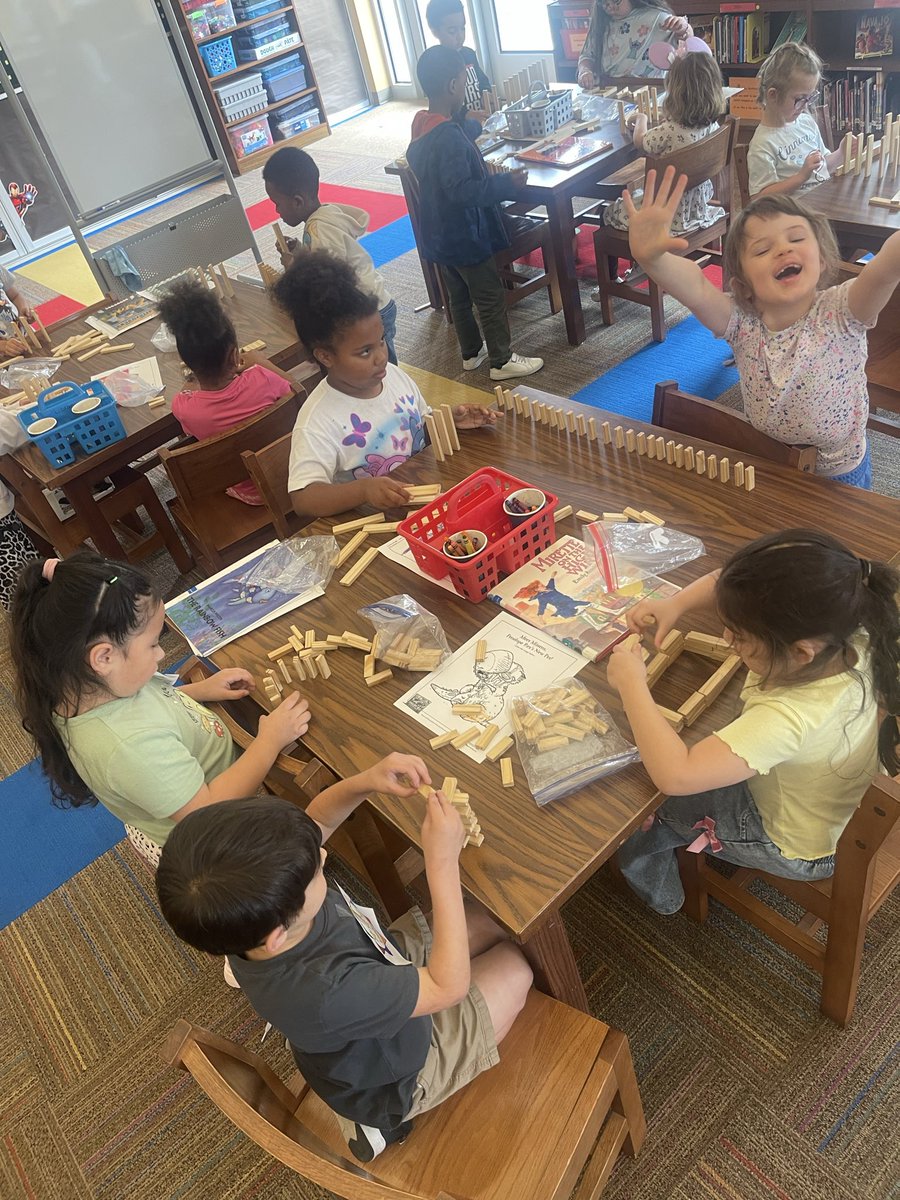 theScottieScoop's tweet photo. Mrs T’s class had a fantastic time in the library creating their very own domino chain reactions! The students carefully set up dominoes and watched with excitement as each one fell perfectly into the next, demonstrating the magic of physics in action. https://t.co/Nu3pizI0aB