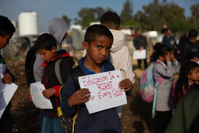 KarrarMartan's tweet image. #Palestinian children protest barbed wire set up by #Israeli "settlers" in the occupied West Bank village of Um al-Khair, demanding access to #school and freedom of movement.

#Israeli forces responded with tear gas and sound grenades on some occasions, affecting children.