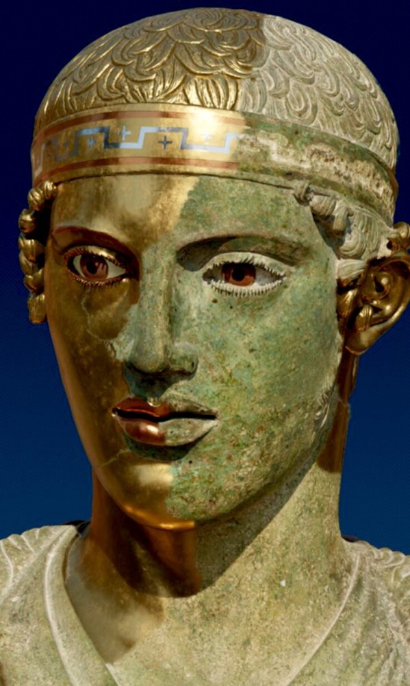 Ivory and rock crystal insets for the eyes, copper lips, and silver teeth