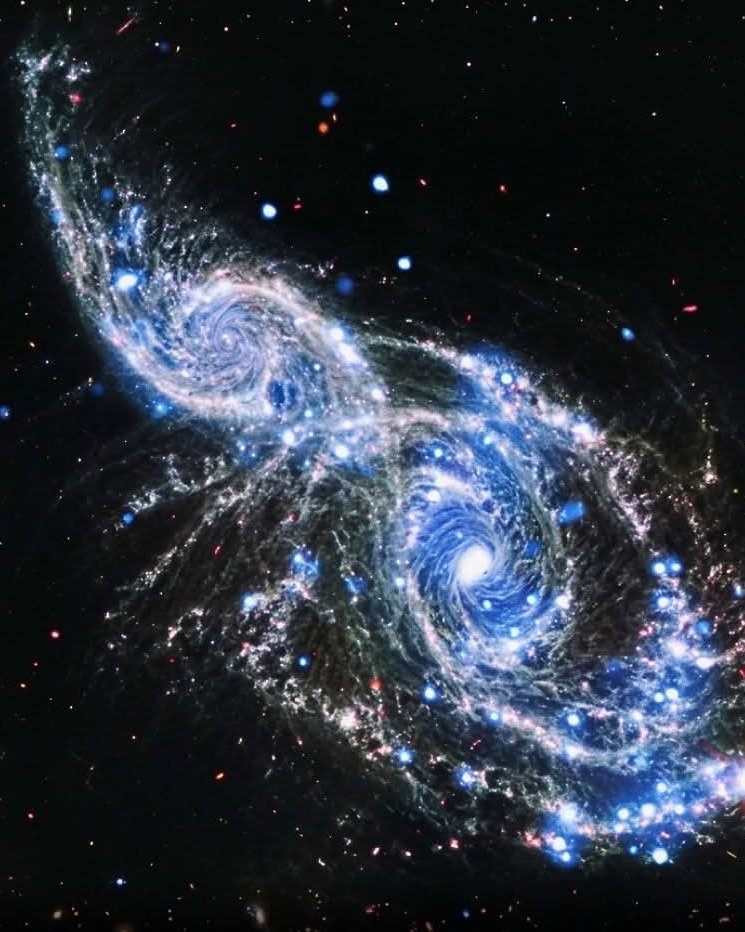 Cosmic Tango:
 James Webb Captures Two Spiral Galaxies in a Slow-Motion Gravitational Embrace!The James Webb Space Telescope has delivered an absolutely stunning portrait of NGC 2207 and IC 2163 — two majestic spiral galaxies locked in an epic gravitational dance 120 million
