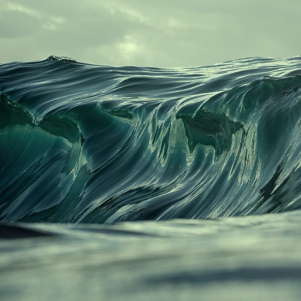 Waves crash against the rocks in the ocean, producing the calming melody of the natural world.